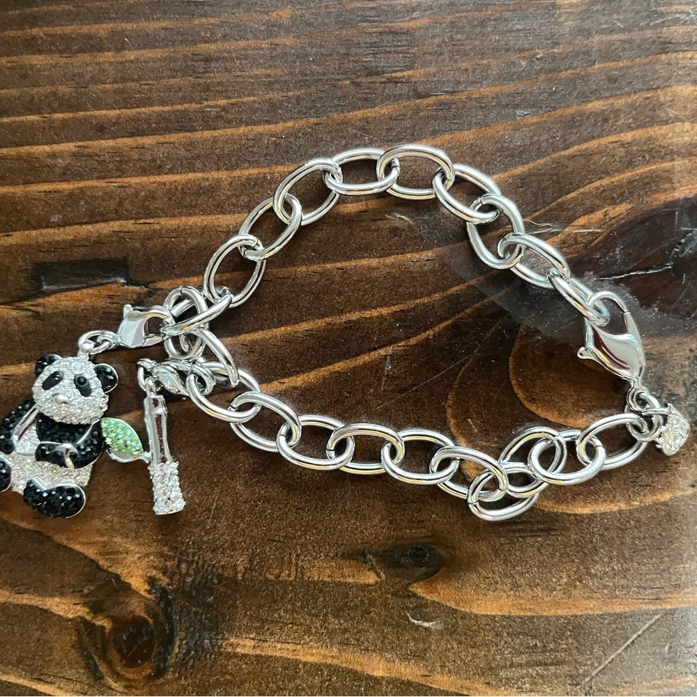 EUC Swarovski limited edition Panda and Bamboo charm bracelet.